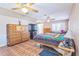 Large main bedroom features dual dressers, a colorful quilt, and shuttered windows at 22465 Lewiston Ave, Port Charlotte, FL 33952