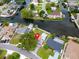 Aerial shot of waterfront homes with private docks and lush landscaping at 250 W Canal Dr, Palm Harbor, FL 34684