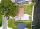 Aerial view of home with waterfront access and lush tree at 250 W Canal Dr, Palm Harbor, FL 34684