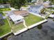 Waterfront backyard with private dock and seating at 250 W Canal Dr, Palm Harbor, FL 34684
