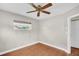 Cozy bedroom featuring hardwood floors and bright natural light at 250 W Canal Dr, Palm Harbor, FL 34684