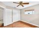 Cozy bedroom with hardwood floors, closet, and natural light at 250 W Canal Dr, Palm Harbor, FL 34684