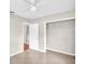 Neutral bedroom with tile flooring and an open closet at 250 W Canal Dr, Palm Harbor, FL 34684