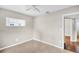 Neutral bedroom with tile flooring and a bright white ceiling fan at 250 W Canal Dr, Palm Harbor, FL 34684