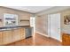 Kitchen features stainless steel appliances, tan cabinetry, and brick accents at 250 W Canal Dr, Palm Harbor, FL 34684
