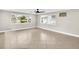 Spacious living room with large windows and tile flooring, offering serene water views at 250 W Canal Dr, Palm Harbor, FL 34684