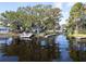 Waterfront view featuring docks and lake access, showcasing the natural beauty of the community at 250 W Canal Dr, Palm Harbor, FL 34684