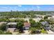 Inviting exterior featuring a private driveway and mature trees, set against a backdrop of the city skyline at 2622 W Horatio St, Tampa, FL 33609
