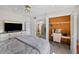 Comfortable bedroom with a closet, dresser, television and work space for functionality at 2693 Sabal Springs Cir # 201, Clearwater, FL 33761