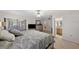Bedroom with ceiling fan, view to the lanai and connected to a bathroom at 2693 Sabal Springs Cir # 201, Clearwater, FL 33761