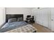 Functional bedroom with a bed, computer, desk, chair and spacious closet at 2693 Sabal Springs Cir # 201, Clearwater, FL 33761