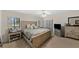 Lovely bedroom with a large bed, ceiling fan and sunny windows at 2693 Sabal Springs Cir # 201, Clearwater, FL 33761