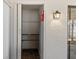 Open closet with tiled floor, shelving and a fire extinguisher attached to the wall at 2693 Sabal Springs Cir # 201, Clearwater, FL 33761