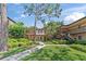 Beautiful condo exterior with well-maintained landscaping, lush green grass, and charming two-story buildings on a sunny day at 2693 Sabal Springs Cir # 201, Clearwater, FL 33761