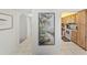 Hallway displaying kitchen with cabinetry and appliances at 2693 Sabal Springs Cir # 201, Clearwater, FL 33761