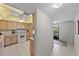 Bright kitchen featuring wood cabinets, tile floors and modern appliances at 2693 Sabal Springs Cir # 201, Clearwater, FL 33761