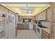 Fully equipped kitchen featuring white appliances and ample cabinet space at 2693 Sabal Springs Cir # 201, Clearwater, FL 33761
