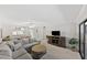 Inviting living room showcases a plush sectional sofa and entertainment center at 2693 Sabal Springs Cir # 201, Clearwater, FL 33761