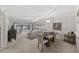 Spacious living room with a combination dining area featuring large sliding glass doors, and ample natural light at 2693 Sabal Springs Cir # 201, Clearwater, FL 33761