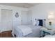 Bright bedroom features two twin beds, wainscotting, and hardwood floors at 2722 Sand Hollow Ct # 2722, Clearwater, FL 33761