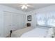 A bright bedroom featuring a comfortable bed, closet, and natural light from a window at 2722 Sand Hollow Ct # 2722, Clearwater, FL 33761
