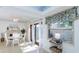 Bright dining area featuring a table set for four, patio view and open to the kitchen at 2722 Sand Hollow Ct # 2722, Clearwater, FL 33761