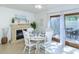 Charming dining room with tiled floors, fireplace, and backyard access at 2722 Sand Hollow Ct # 2722, Clearwater, FL 33761