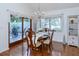 Cozy dining area with hardwood floors, chandelier, and a view of the backyard patio at 2722 Sand Hollow Ct # 2722, Clearwater, FL 33761