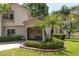 Inviting home exterior with manicured hedges, front patio, and American flag at 2722 Sand Hollow Ct # 2722, Clearwater, FL 33761