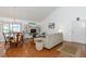 Inviting living room with hardwood floors, comfortable sofa, and entertainment center at 2722 Sand Hollow Ct # 2722, Clearwater, FL 33761