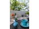 Close up of outdoor dining table, cup and flower on a brick patio at 2722 Sand Hollow Ct # 2722, Clearwater, FL 33761