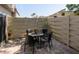 Private brick patio with outdoor dining set and privacy fence at 2722 Sand Hollow Ct # 2722, Clearwater, FL 33761