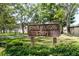 Community sign displaying 'Sand Hollow Court' in a landscaped setting at 2722 Sand Hollow Ct # 2722, Clearwater, FL 33761