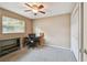 Neutral bedroom featuring a closet, desk, and ceiling fan at 3072 Keene Park Dr, Largo, FL 33771