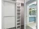 A closet with mirror and shelves and a view into another room at 3072 Keene Park Dr, Largo, FL 33771