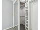 A bedroom closet with shelving and mirrored sliding door at 3072 Keene Park Dr, Largo, FL 33771