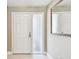Welcoming entryway featuring a white front door, sidelight, and neutral paint at 3072 Keene Park Dr, Largo, FL 33771