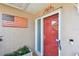 A vibrant red front door welcomes you to this charming home, complete with modern security features at 3072 Keene Park Dr, Largo, FL 33771