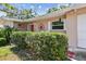 Charming front porch with decorative accents and neat landscaping, enhancing the curb appeal of this inviting home at 3072 Keene Park Dr, Largo, FL 33771