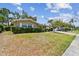 Charming single-story home with well-maintained lawn and mature landscaping, creating a welcoming curb appeal at 3072 Keene Park Dr, Largo, FL 33771