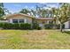 Charming single-story home with mature landscaping, manicured lawn, and inviting curb appeal at 3072 Keene Park Dr, Largo, FL 33771