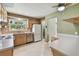 Efficient kitchen featuring ample cabinetry and natural light from the window at 3072 Keene Park Dr, Largo, FL 33771