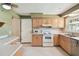 Well-lit kitchen with ample counter space, tile flooring, and modern appliances at 3072 Keene Park Dr, Largo, FL 33771