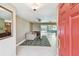 Inviting living room with tile flooring, a ceiling fan, and access to the outdoor pool area through sliding doors at 3072 Keene Park Dr, Largo, FL 33771