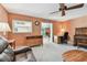 A living room and office space combination with a wall-mounted climate control at 3072 Keene Park Dr, Largo, FL 33771