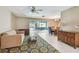Open living room with a view of the outdoor seating area and the swimming pool at 3072 Keene Park Dr, Largo, FL 33771