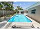 Relaxing backyard featuring a pool, perfect for enjoying warm days with Gathering and friends in a private setting at 3072 Keene Park Dr, Largo, FL 33771