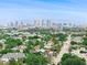 Stunning aerial view of neighborhood featuring lush greenery and a striking city skyline backdrop at 310 S Habana Ave # 5, Tampa, FL 33609
