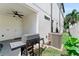 An inviting back patio boasts a ceiling fan and outdoor kitchen setup, great for entertaining at 310 S Habana Ave # 5, Tampa, FL 33609