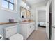 This stylish bathroom offers a double vanity, decorative mirror, and soft blue accents at 310 S Habana Ave # 5, Tampa, FL 33609